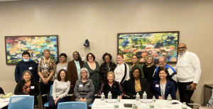 A diverse group of Philadelphia community members and academic partners in a training session.